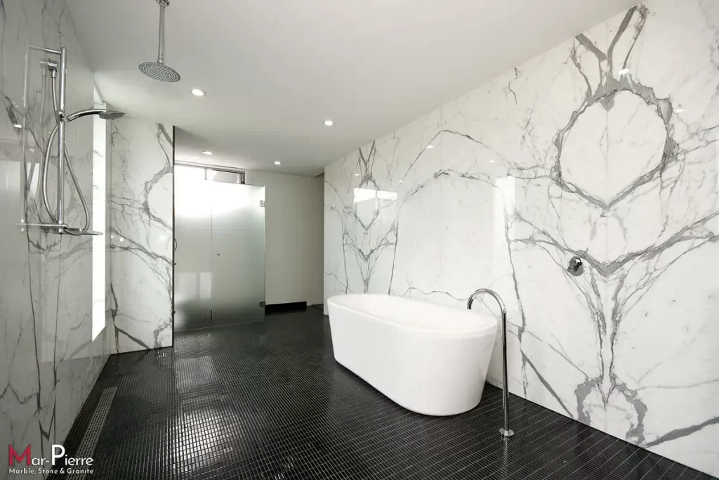 bathroom with white statuary marble cladding made of open stain